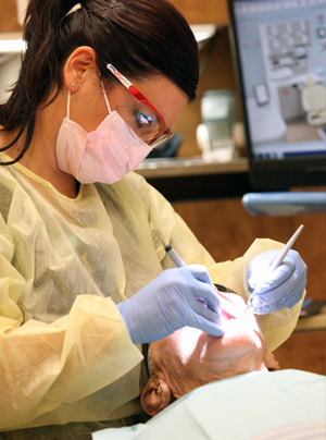 Dental hygienist and patient at AFRH
