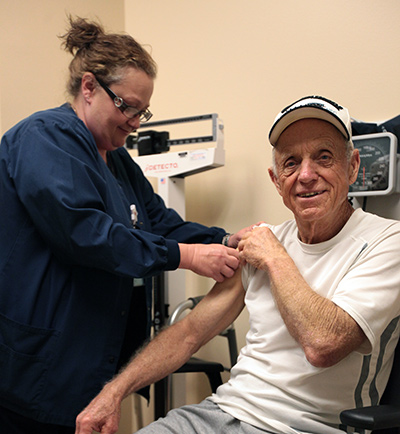 AFRH caregiver attends to a resident AFRH caregiver attends to a resident